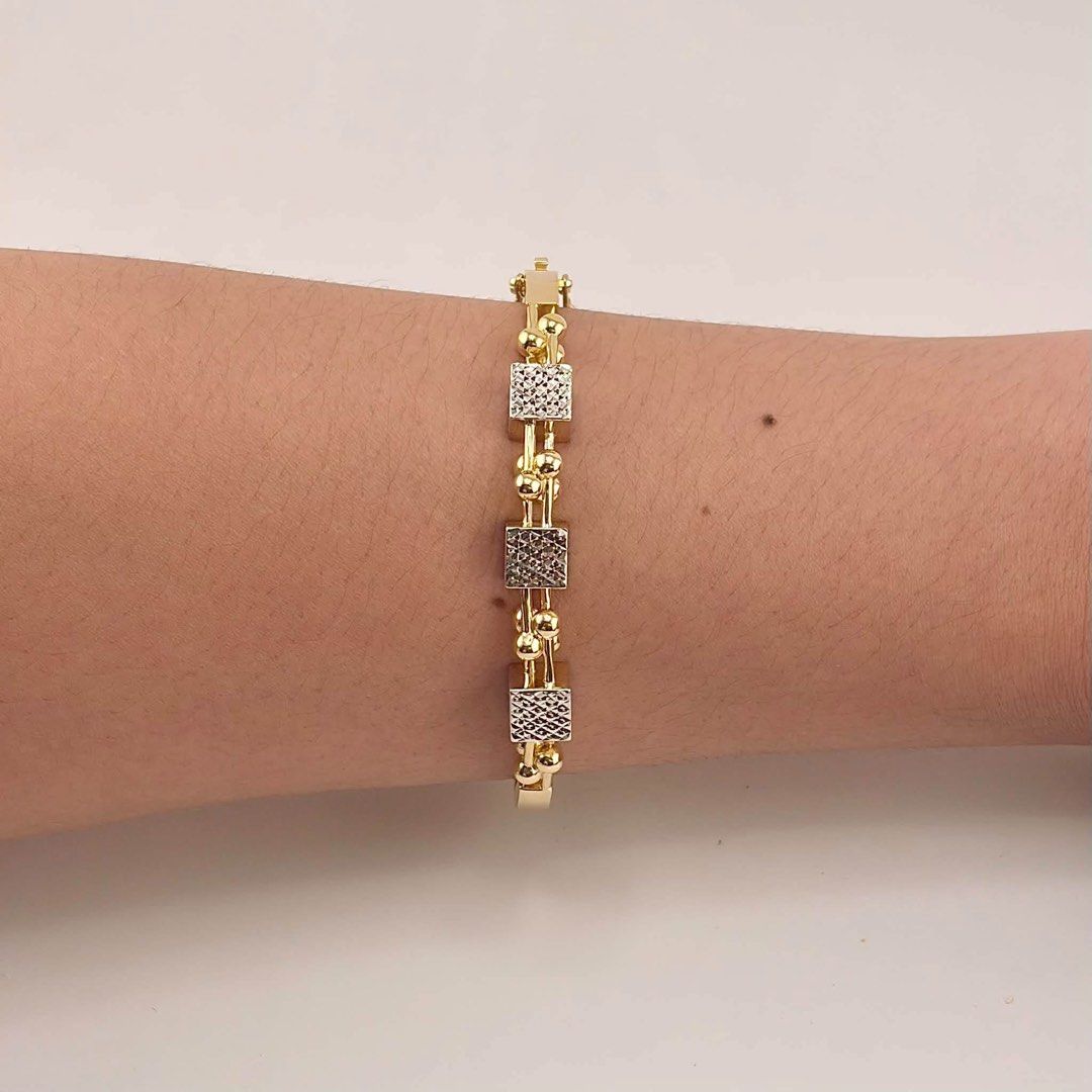 18k Saudi Gold Two Toned Bangle (Category: Bracelets) located in Cabuyao City. Submitted by whatellawore (Listing ID 1466600846, Image 1). Description: size 16cm 10.7g for shipping ONLY buyer will shoulder shipping fee.