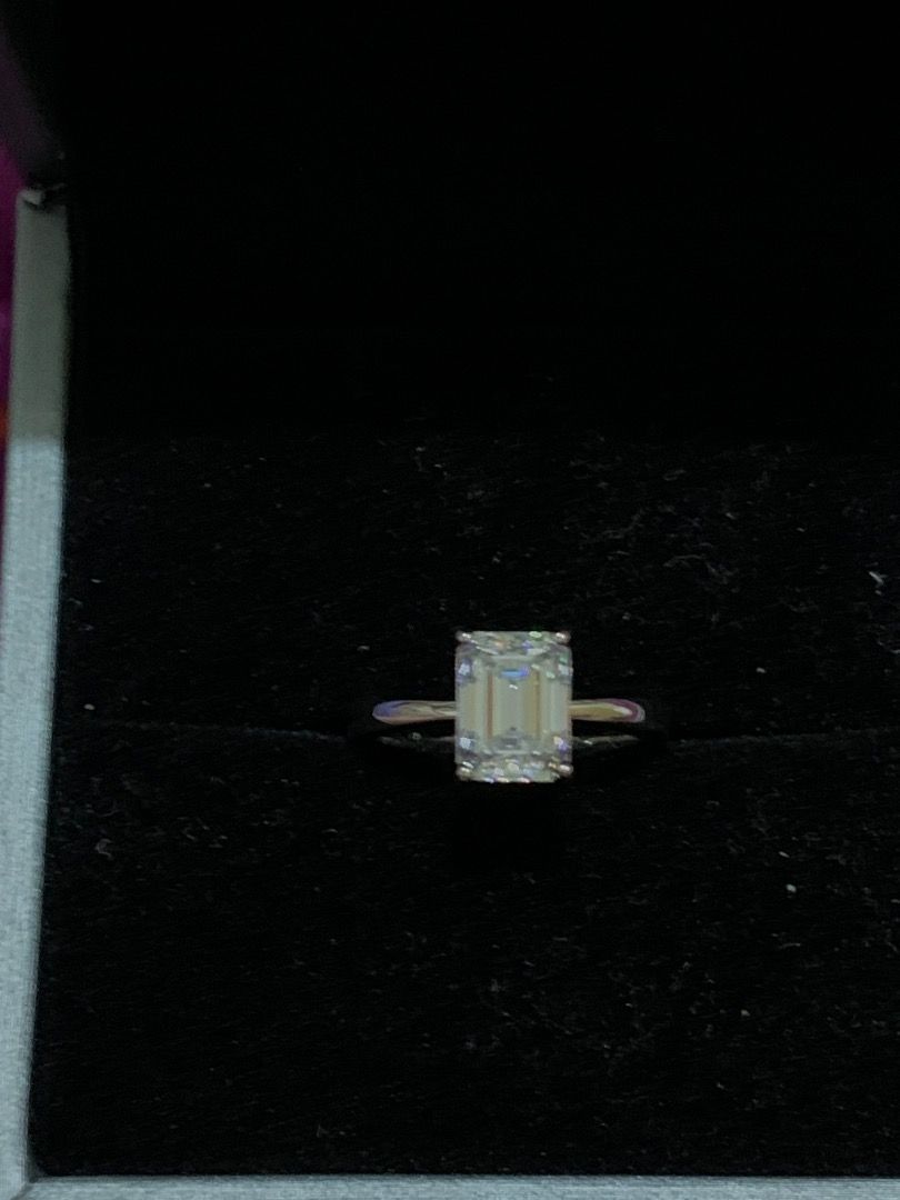 2 carat Emerald Cut Moissanite Adjustable S925 Ring (Category: Rings) located in Quezon City. Submitted by itscxyy (Listing ID 1466759023, Image 1). Description: - With GRA Certificate - Material: Adjustable band and S925 stamped - Stone: 2 Carat Moissanite stone (D color) - Design: Classic solitaire prong high-setting on a thin polished band - Perfect for Engagement ring or gifting.