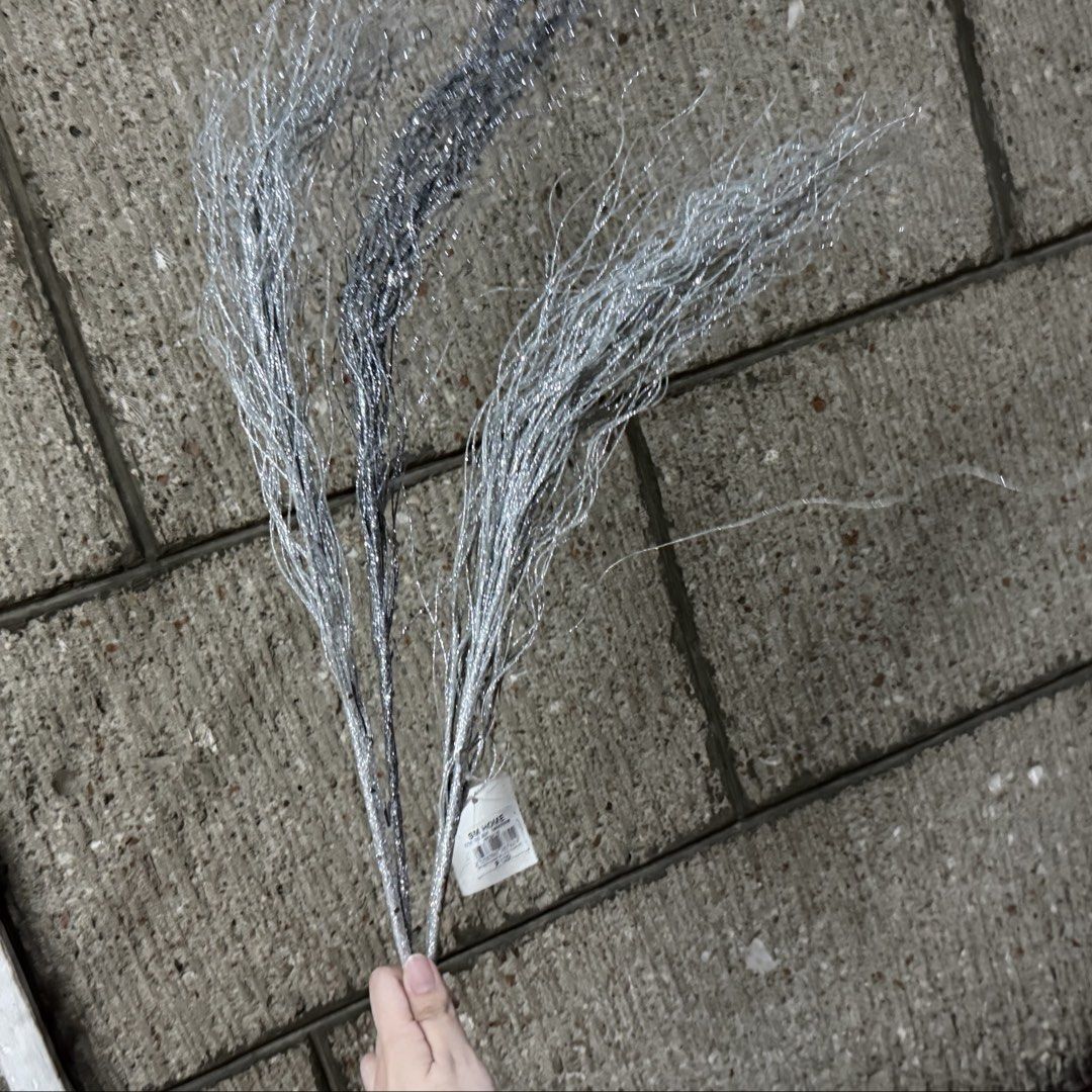 3pcs SET SM Home silver decorative branches twig bundle set (Category: Artificial Plants & Flowers) located in Marikina City. Submitted by lovegoeson (Listing ID 1466576928, Image 1). Description: - Brand: SM Home - Quantity: Set of 3 silver glitter decorative twig branches - Condition: Brand new with original retail tag attached - Features: Textured stems with wispy ends and shimmer dust - Perfect for: Holiday arrangements, tall vases, and table