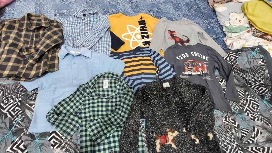 3T-4T BRANDED BUNDLE CLOTHES (Category: Babies & Kids Fashion) located in Manila. Submitted by phcarousince2016 (Listing ID 1466648821, Image 1). Description: - Size: 3T toddler boys - Brands include: Tommy Hilfiger, Gap, Cat & Jack, and Garanimals - Variety of styles: Long sleeve tees, button-down shirts, and a chunky knit sweater with dog graphics - Colors & patterns: Blue plaid, green check, grey fire engine graphic, and stripes - Condition: G