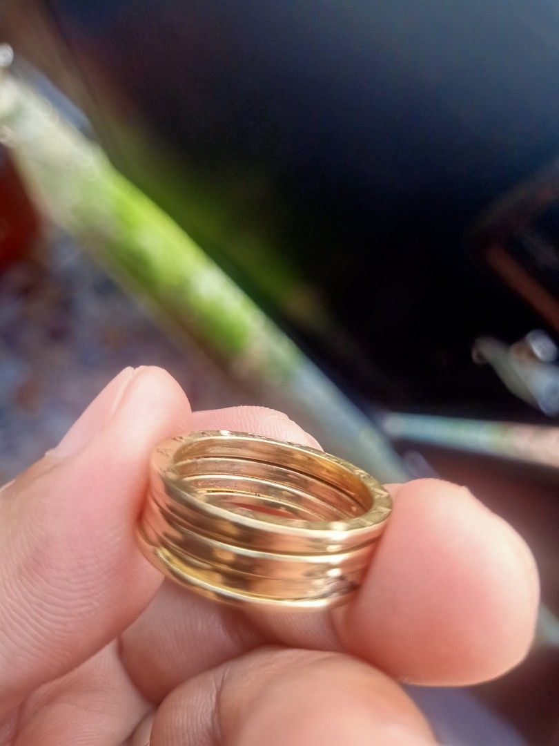 6100/gram only! Bvlgari 18K Gold Ring (Category: Jewelry) located in Pasay City. Submitted by _ladybags (Listing ID 1466772515, Image 2). Description: - Metal: Solid 18K Yellow Gold - Design: Classic Bvlgari multi-band spiral with iconic outer rim logo engravings - Weight: 7.13 grams - Condition: Minor defect due to previous handling, please check closeups. size 10 and 7.1* grams. Loc Tanza, Cavite..