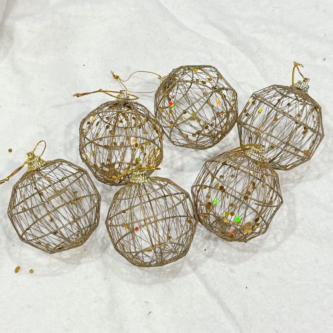 6pcs SET Gold Wire Christmas Tree Ornaments (Category: Vintage Collectibles) located in Marikina City. Submitted by lovegoeson (Listing ID 1466576615, Image 1). Description: - Set of 6 round wire ornaments for holiday decor - Elegant metallic gold finish with shimmering glitter accents - Lightweight woven wire design won't weigh down tree branches - Includes a small loop at the top with matching gold hanging string - Beautiful rustic style to ele