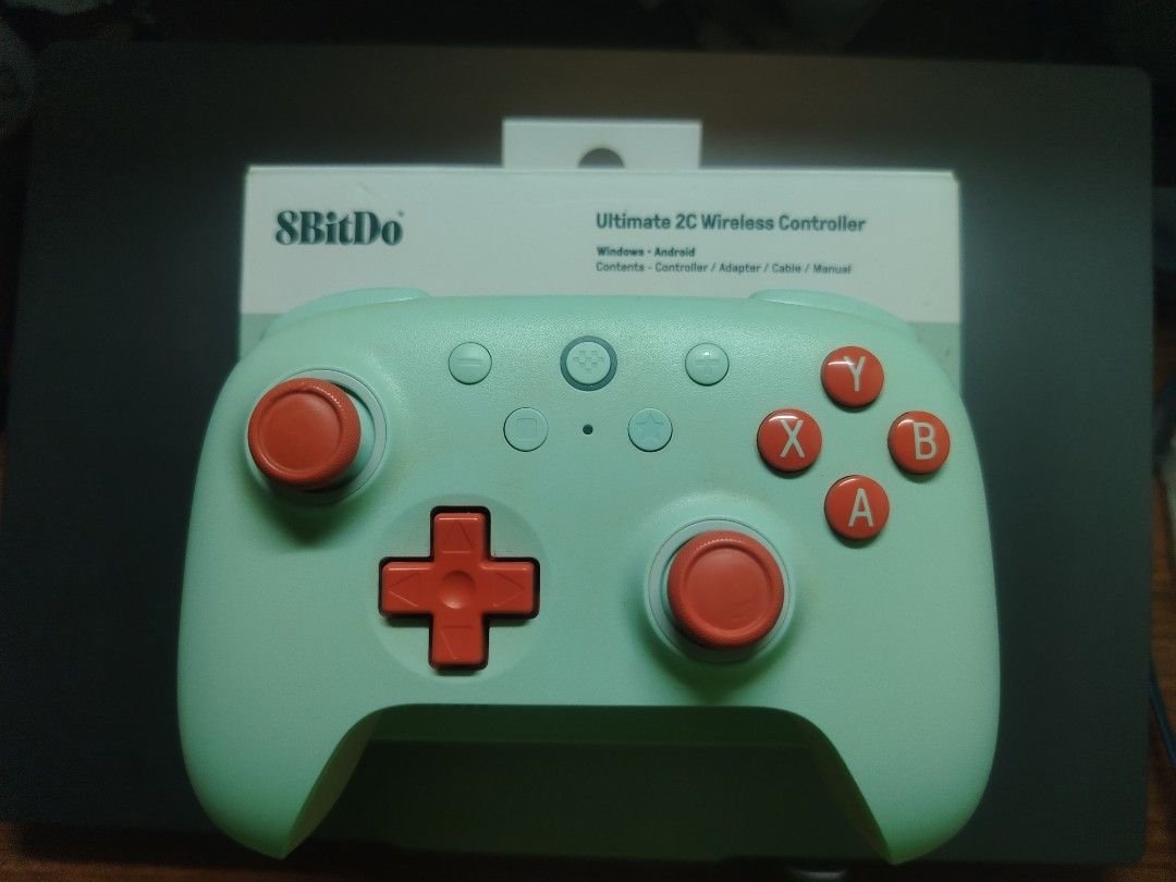 8BitDo Ultimate 2C Wireless Controller (Category: Controllers) located in Subang Jaya. Submitted by joshua_cham (Listing ID 1466672664, Image 1). Description: - Brand: 8BitDo Wireless Controller - Color: Mint green with red buttons and joysticks - Compatibility: Windows and Android systems - Condition: Complete with original box, adapter, cable, and manual - Can PM for more info.