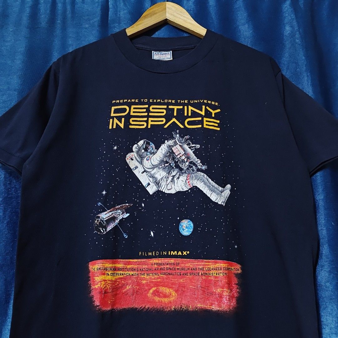 90's DESTINY IN SPACE BY SMITH SONIAN IMAX TEE (Category: Tshirts & Polo Shirts ) located in Makati City. Submitted by upcycled.closeth (Listing ID 1466584431, Image 2). Description: - Authentic 90's destiny in space product - Navy blue, short-sleeved - Size: Medium (men's) - Like new - Tag: All sports pro weight - Authentic from the 90's shirt - flaws: no flaws - Excellent condition - Need wash, fresh from bale - Features design of All sports mo