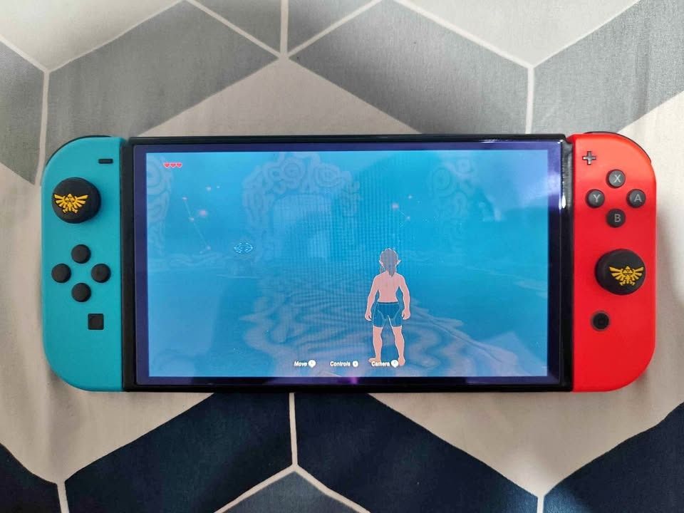 🎮 NINTENDO SWITCH OLED COMPLETE BUNDLE + ZELDA BOTW + 2 EXTRA CONTROLLERS (Category: Nintendo) located in Manila. Submitted by luna.2214 (Listing ID 1466648337, Image 2). Description: 🎮 NINTENDO SWITCH OLED COMPLETE BUNDLE + ZELDA BOTW + 2 EXTRA CONTROLLERS 💰 PRICE: ₱16,000 — SLIGHTLY NEGOTIABLE Selling my Nintendo Switch OLED complete with original accessories, Zelda: Breath of the Wild physical copy, 2 extra controllers, and multiple cases/a