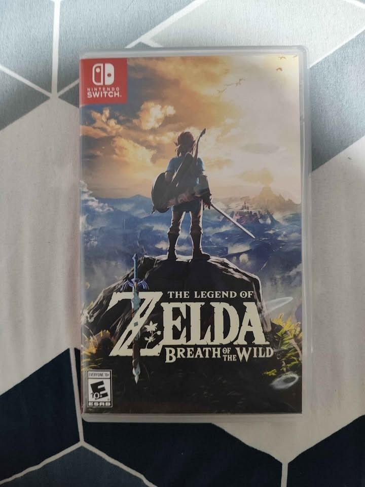 🎮 NINTENDO SWITCH OLED COMPLETE BUNDLE + ZELDA BOTW + 2 EXTRA CONTROLLERS (Category: Nintendo) located in Manila. Submitted by luna.2214 (Listing ID 1466648337, Image 3). Description: 🎮 NINTENDO SWITCH OLED COMPLETE BUNDLE + ZELDA BOTW + 2 EXTRA CONTROLLERS 💰 PRICE: ₱16,000 — SLIGHTLY NEGOTIABLE Selling my Nintendo Switch OLED complete with original accessories, Zelda: Breath of the Wild physical copy, 2 extra controllers, and multiple cases/a