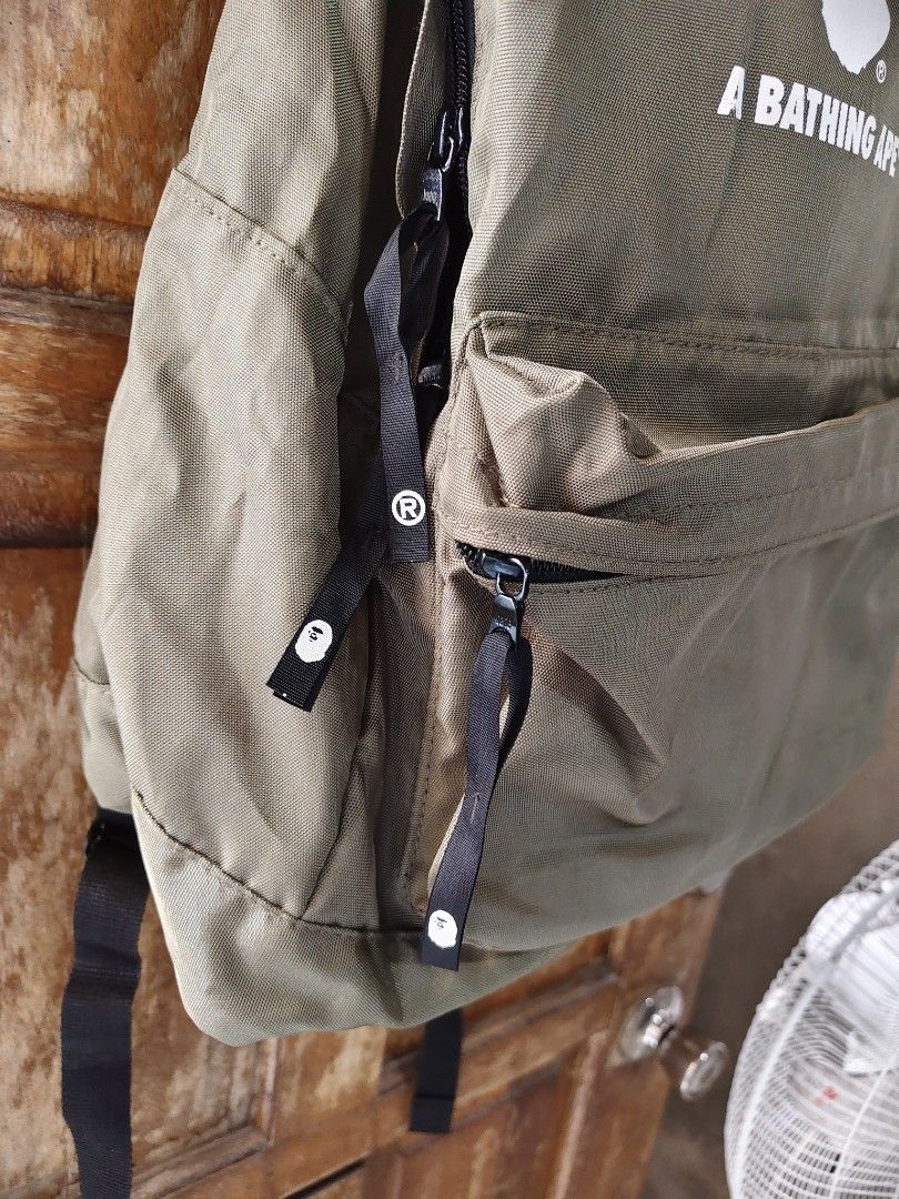 A Bathing ape (Bape) Olive Day Pack ( Authentic) (Category: Backpacks) located in Iloilo. Submitted by branded-boy0422_16 (Listing ID 1466566593, Image 2). Description: Authentic W: 15 L: 19 Good as new 10/10 Solid nito No Stain, Scratch, or pinhole.