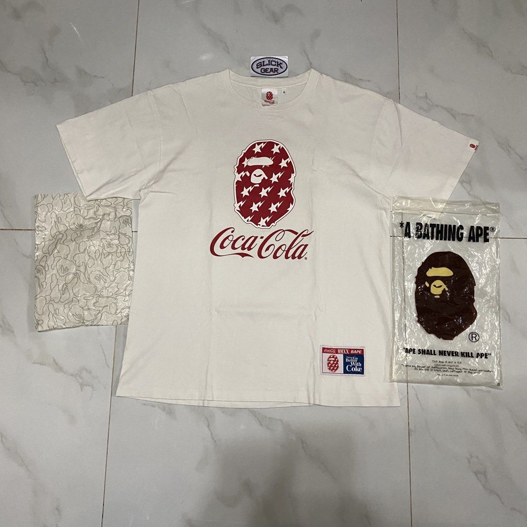 A Bathing Ape x Coca-Cola Tee from the Spring/Summer 2020 collection (Category: Tshirts & Polo Shirts ) located in Quezon City. Submitted by slickgearph (Listing ID 1466771707, Image 1). Description: A Bathing Ape x Coca-Cola Tee from the Spring/Summer 2020 collection Size XL Condition 9/10 ₱2,000 IG: slickgearph.