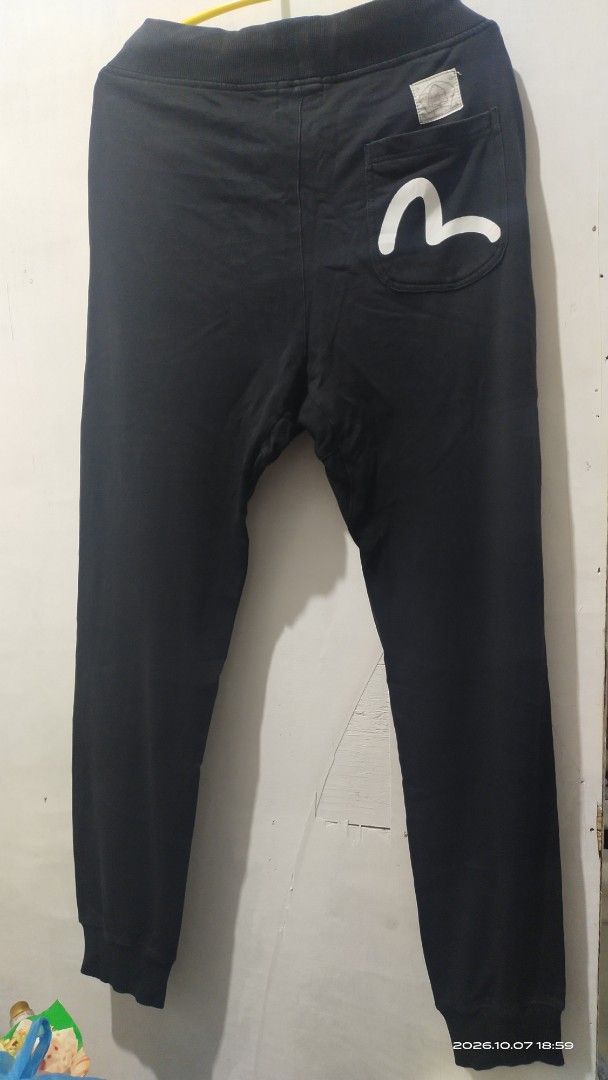Aape x Evisu Black Sweatpants Size L (Category: Joggers) located in Manila. Submitted by rhobin.m08 (Listing ID 1466694280, Image 2). Description: - Brand: Aape x Evisu - Color: Black - Size: Large (L) - Material: 100% premium cotton for all-day comfort - Design: Features eye-catching Evisu and B One Soul front graphics - Back Detail: Signature Evisu pocket graphic - Fit & Features: Adjustable white drawstring waist and ribbed ankle cuffs - Condi