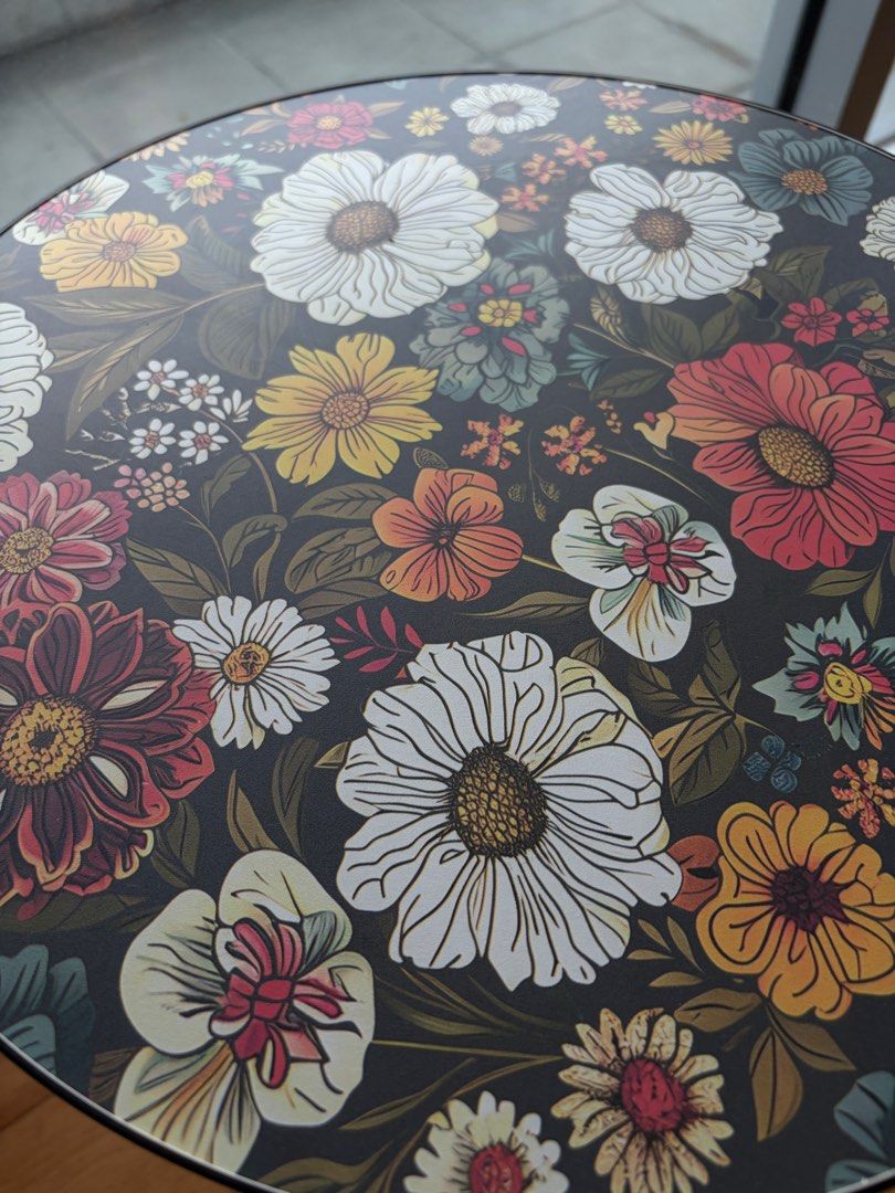 Accent Side Table with Wooden Legs (Category: Tables & Sets) located in Mandaluyong City. Submitted by vickydeclutter (Listing ID 1466640180, Image 2). Description: I was using it for my portrait display and some candles. This is decorative table only Price negotiable - Type: Round side table - Design: Dark floral print with vibrant white, yellow, and red flowers - Build: Sturdy tabletop with smooth edges and three screw-in wooden legs with secur