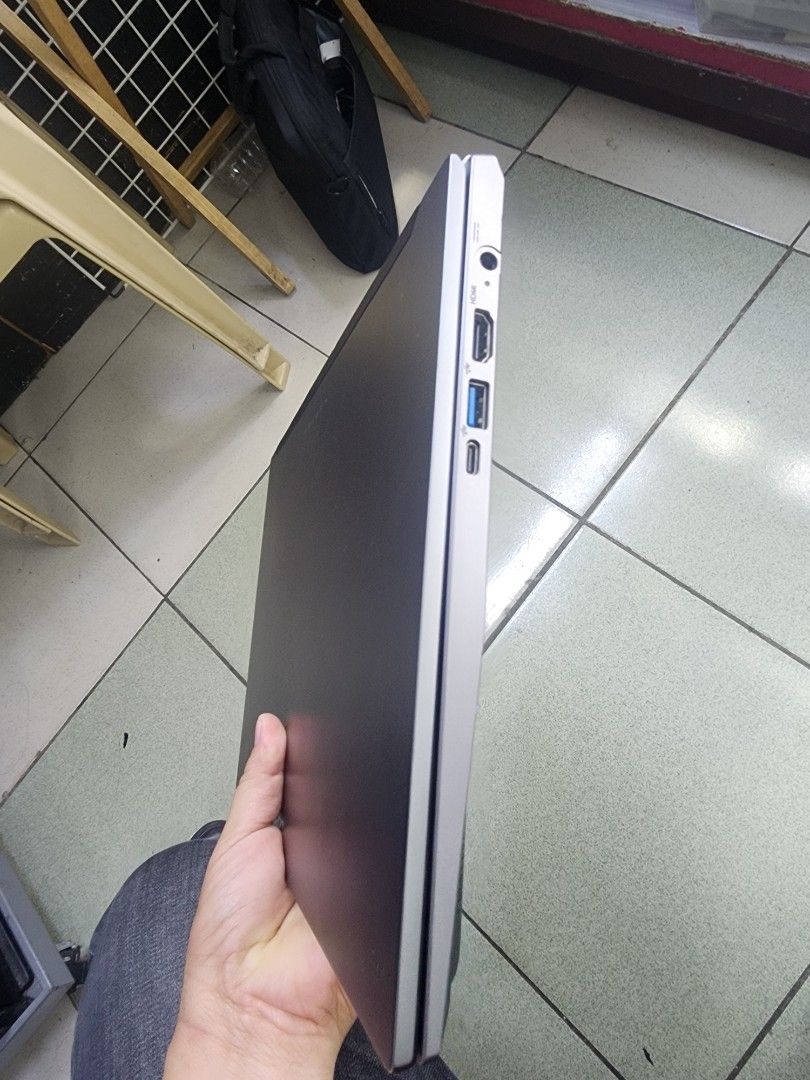 Acer Laptop Silver,corei5,11generation. (Category: Laptops & Notebooks) located in Manila. Submitted by abdulfatak37758 (Listing ID 1466726944, Image 3). Description: - Sleek silver finish with a clean metallic lid and Acer logo - Compact and practical design, ideal for daily work or studies - Excellent thermal management with large bottom ventilation grilles and visible cooling fan - Versatile connectivity including HDMI, USB ports, USB-C, and a