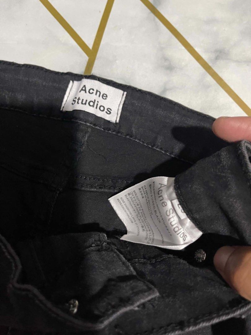 Acne Studios Skin 5 Used Black Jeans (Category: Jeans) located in Manila. Submitted by fastforest_65f95b (Listing ID 1466726608, Image 2). Description: - Brand: Acne Studios - Style: Skin 5 (Mid-rise, button and zip fly) - Material: 92% cotton, 5% polyester, 3% elastane - Country of Origin: Albania - Details: Distressed knees with ripped detailing and a unique lace trim hem at the ankles.