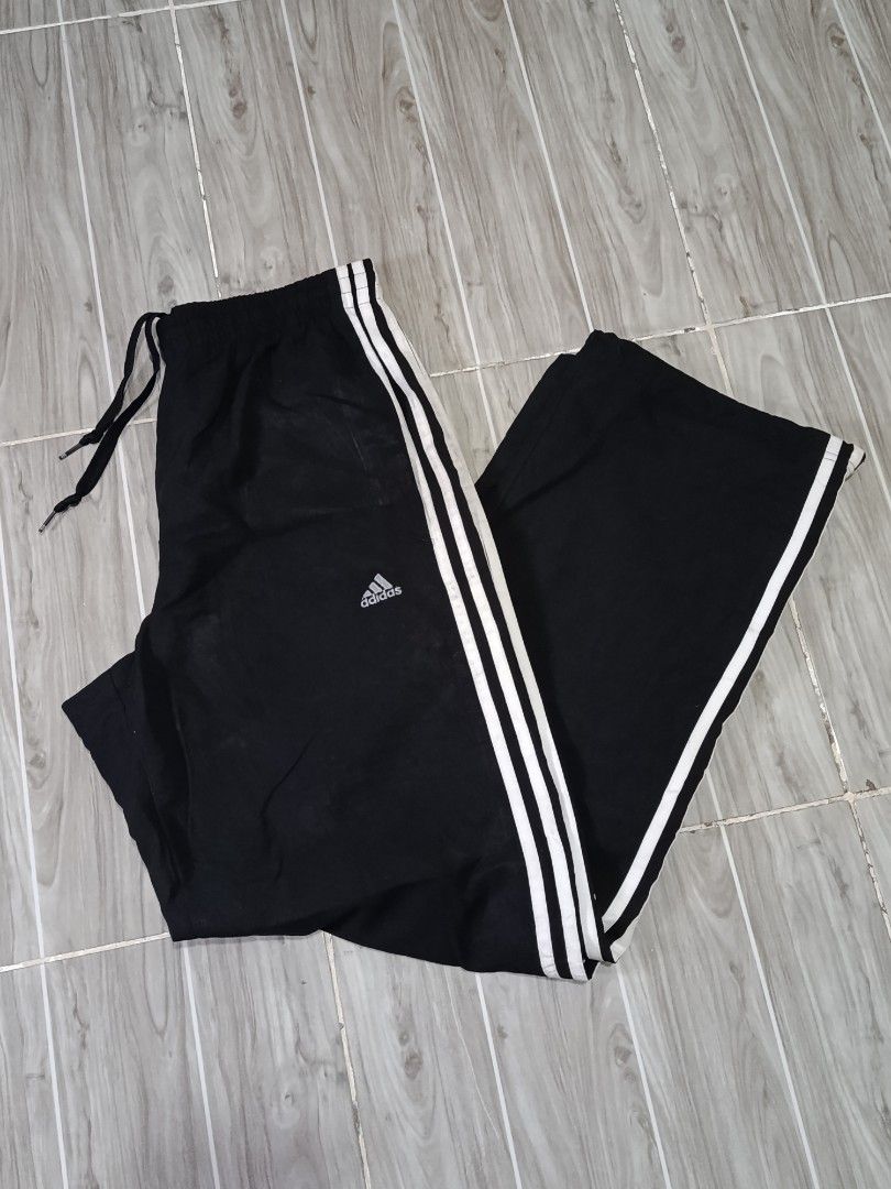 ADIDAS 3LINES NYLON ESSENTIALS JOGGING PANTS (freeshipping) (Category: Activewear) located in Quezon City. Submitted by gyl-stop (Listing ID 1466723689, Image 2). Description: free shipping 30-35 x 41 excellent condi cr: 9.8/10 issue: none.