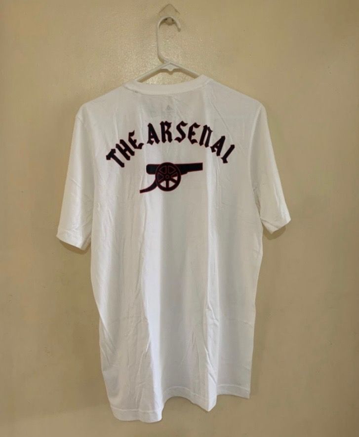 Adidas Arsenal Tshirt Unisex (Category: Tshirts & Polo Shirts ) located in Valenzuela. Submitted by clickandshoppreloved (Listing ID 1466624499, Image 2). Description: Adidas Arsenal Tshirt Mens SRP 1500 Sale Price 799 Onhand, Original Brandnew Medium Ontag, (29L x 21M) Color : White.