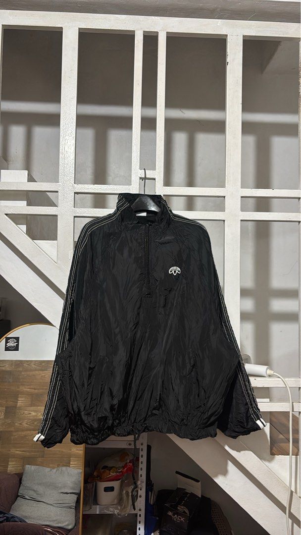 Adidas Black Half-Zip Windbreaker Jacket (Category: Coats, Jackets and Outerwear) located in Batangas. Submitted by franzbucal (Listing ID 1466608435, Image 1). Description: - Authentic black Adidas half-zip windbreaker jacket - Classic white 3-stripes down the sleeves with embroidered trefoil logo on the chest - Lightweight, crinkled nylon material ideal for Philippine weather - High neckline with sturdy zipper pull - Adjustable drawstring hem f