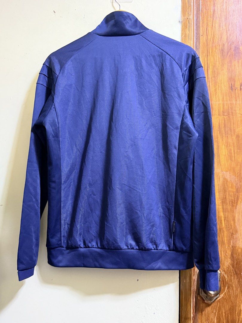 Adidas Blue Track Jacket Size L (Category: Coats, Jackets and Outerwear) located in Paete. Submitted by skydruemadison (Listing ID 1466578820, Image 2). Description: - Authentic Navy Blue Adidas Track Jacket - Size: L (UK/US standard sizing) - Design: Full zip front, stand-up collar, and stylish arm stripes - Details: Unique textured pattern on upper chest and back panels - Storage: Two secure zippered side pockets - Condition: Clean, excellent, 