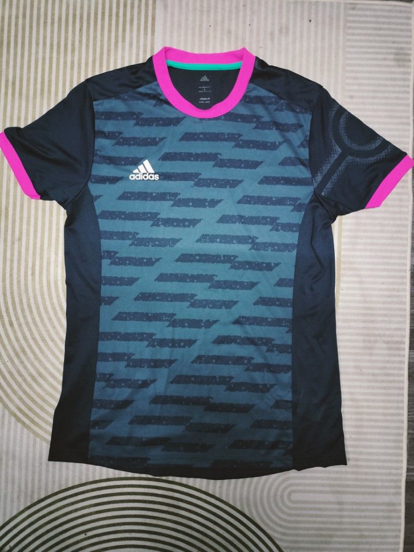 Adidas climacool Jersey shirt (Category: Activewear) located in Manila. Submitted by cyn.declutters (Listing ID 1466638982, Image 1). Description: in dark navy blue and grey w/ pink turquiose accent size large loc Cainta.