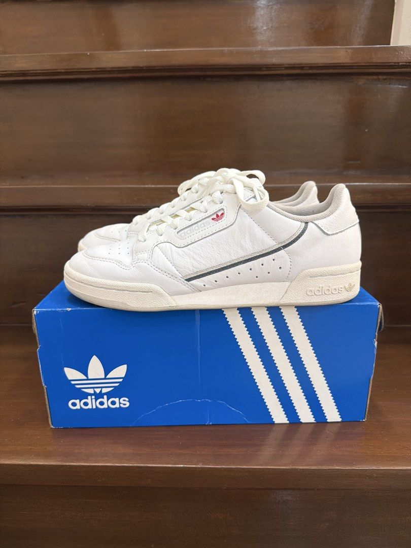 Adidas Continental 80 White Sneakers (Category: Sneakers) located in San Juan City. Submitted by hazeldee (Listing ID 1466713396, Image 3). Description: - Brand: Adidas Continental 80 - Color: White leather with red and navy side stripes - Condition: Clean white soles, minimal toe box creasing - Packaging: Comes in original blue Adidas box 100% Authentic Used less than 5 times Excellent condition US 7.5 UK 7 CHN 250 25 CM .