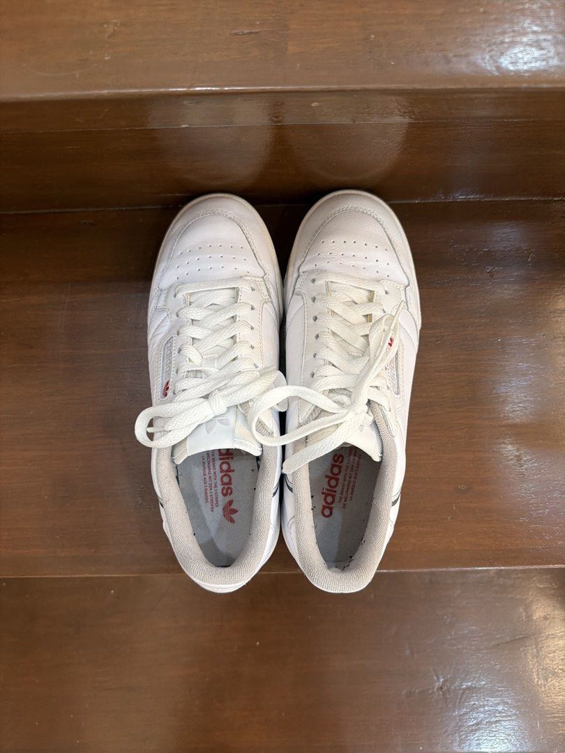 Adidas Continental 80 White Sneakers (Category: Sneakers) located in San Juan City. Submitted by hazeldee (Listing ID 1466713396, Image 2). Description: - Brand: Adidas Continental 80 - Color: White leather with red and navy side stripes - Condition: Clean white soles, minimal toe box creasing - Packaging: Comes in original blue Adidas box 100% Authentic Used less than 5 times Excellent condition US 7.5 UK 7 CHN 250 25 CM .