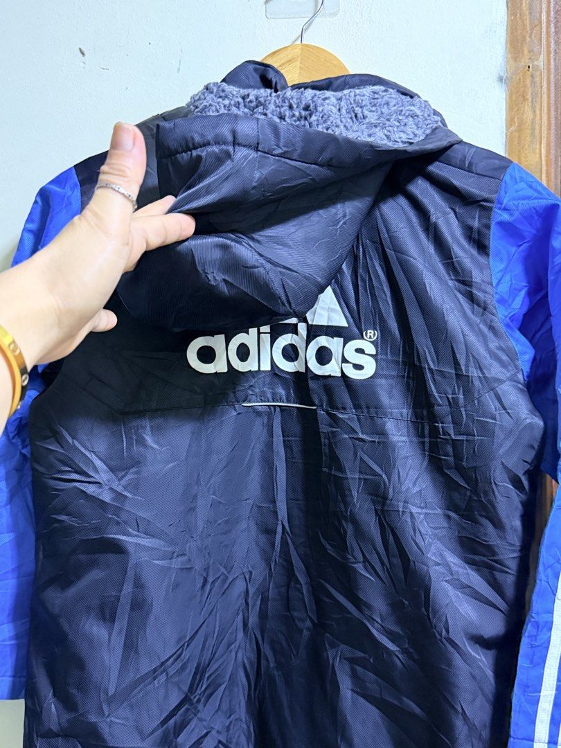 Adidas Long Jacket Blue Black Fleece Lined (Category: Babies & Kids Fashion) located in Paete. Submitted by skydruemadison (Listing ID 1466684699, Image 3). Description: Adidas long jacket in blue and black. Bright green full zip closure down the front. Cozy grey fleece lining inside the upper body and hood. White three stripe branding on the sleeves. Large Adidas logo printed on the back. Hood attached..