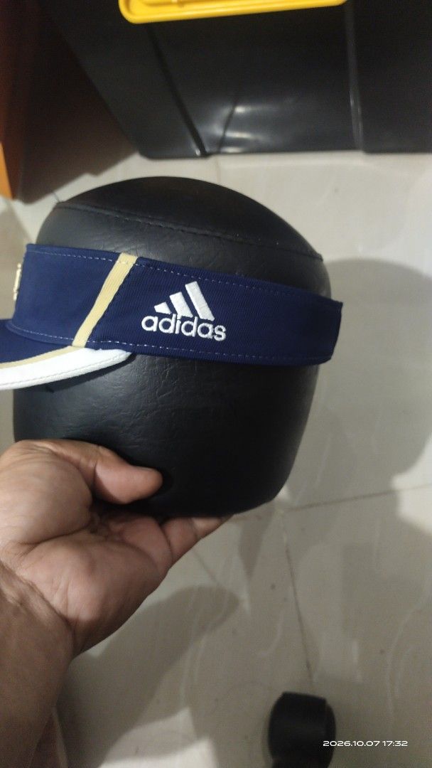 Adidas Notre Dame Fighting Irish Visor Hat (Category: Caps & Hats) located in Manila. Submitted by rhobin.m08 (Listing ID 1466703446, Image 3). Description: - Official Adidas University of Notre Dame headwear supplier - Classic blue visor with white brim and gold piping details - Embroidered Notre Dame shield logo on the front - IRISH text printed on the adjustable Velcro back strap - Features Adidas branding on the side and inner label - Comfort