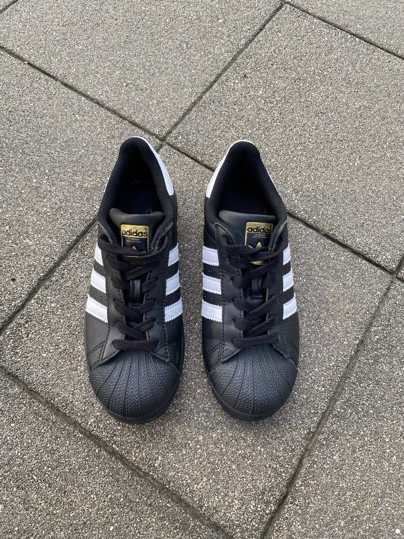 Adidas Superstar Black White Shoes (Category: Sneakers) located in Davao. Submitted by thirdy.pfp (Listing ID 1466654411, Image 3). Description: Adidas Superstar Classics (3) 6 us / 24 cm Excellent 9/10 -1300 - Brand/Model: Adidas Superstar - Colorway: Classic Black and White - Design: Iconic shell toe, signature three stripes, and white heel tab - Branding: Premium gold branding on the tongue and side, plus a gold trefoil logo on the heel - Cond