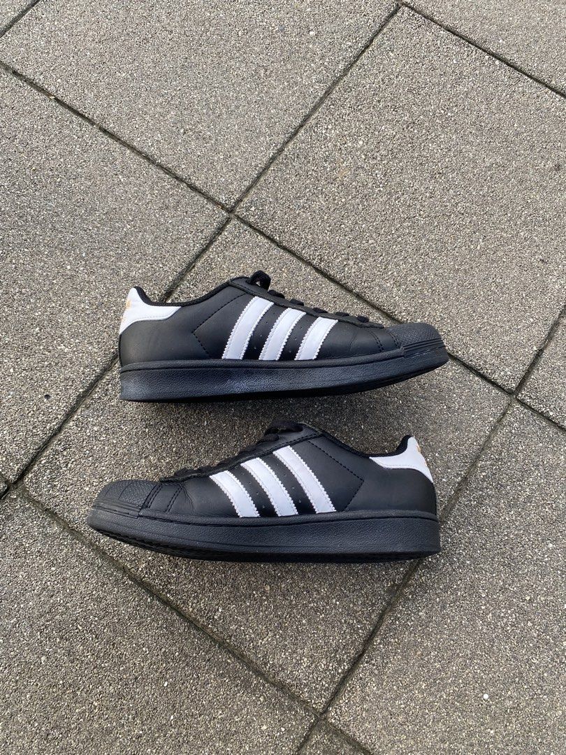Adidas Superstar Black White Shoes (Category: Sneakers) located in Davao. Submitted by thirdy.pfp (Listing ID 1466654411, Image 2). Description: Adidas Superstar Classics (3) 6 us / 24 cm Excellent 9/10 -1300 - Brand/Model: Adidas Superstar - Colorway: Classic Black and White - Design: Iconic shell toe, signature three stripes, and white heel tab - Branding: Premium gold branding on the tongue and side, plus a gold trefoil logo on the heel - Cond