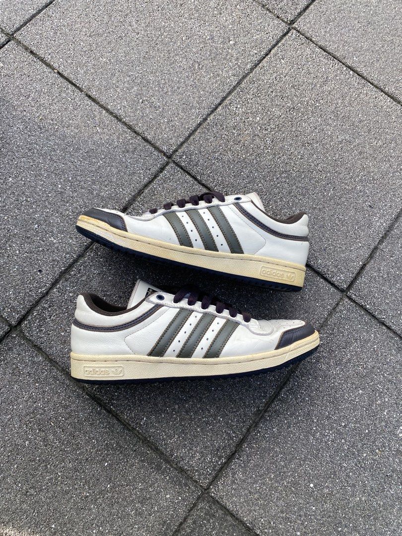 Adidas Top Ten Low White Brown Olive (Category: Sneakers) located in Davao. Submitted by thirdy.pfp (Listing ID 1466654421, Image 1). Description: Adidas Top Ten Low Cream Olive 8 us / 25 cm Excellent 9/10 *yellowish sole -1500 - Brand: Adidas Top Ten Low - Colorway: White leather upper with dark brown and olive green stripes - Details: Dark laces, brown collar trim, and a stylish vintage yellowed midsole - Condition: Very minimal wear on soles w