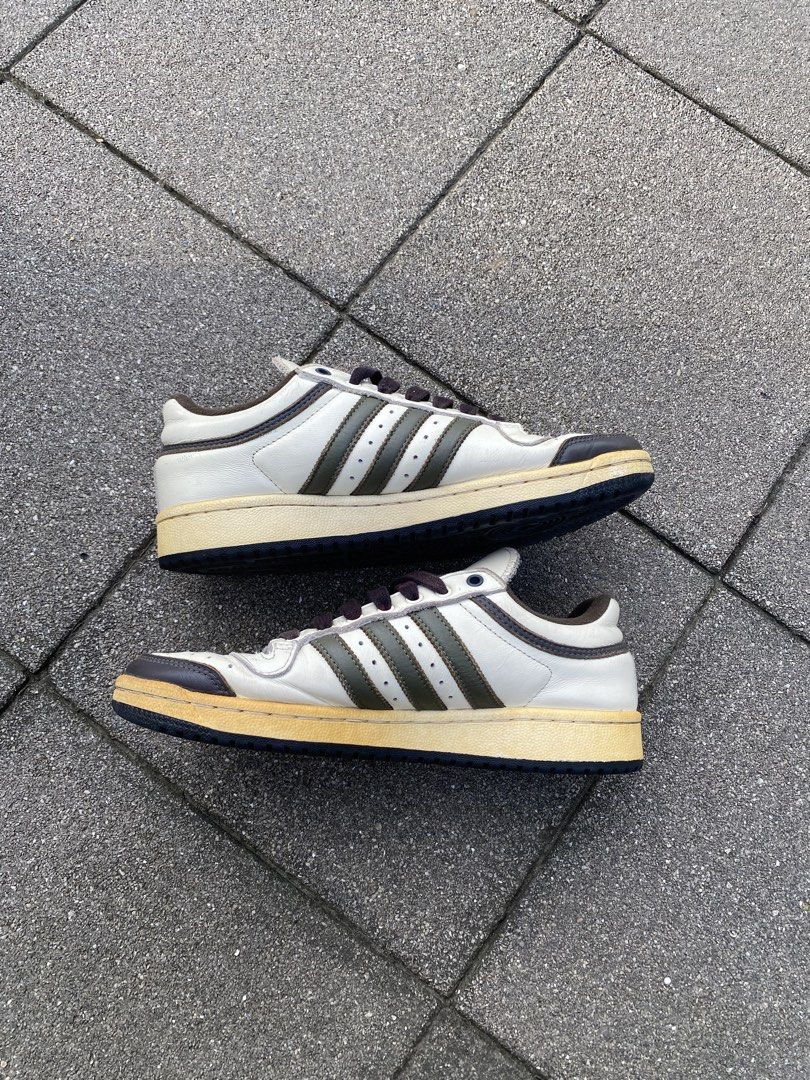 Adidas Top Ten Low White Brown Olive (Category: Sneakers) located in Davao. Submitted by thirdy.pfp (Listing ID 1466654421, Image 2). Description: Adidas Top Ten Low Cream Olive 8 us / 25 cm Excellent 9/10 *yellowish sole -1500 - Brand: Adidas Top Ten Low - Colorway: White leather upper with dark brown and olive green stripes - Details: Dark laces, brown collar trim, and a stylish vintage yellowed midsole - Condition: Very minimal wear on soles w