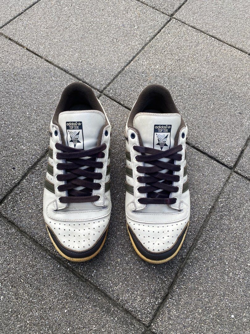 Adidas Top Ten Low White Brown Olive (Category: Sneakers) located in Davao. Submitted by thirdy.pfp (Listing ID 1466654421, Image 3). Description: Adidas Top Ten Low Cream Olive 8 us / 25 cm Excellent 9/10 *yellowish sole -1500 - Brand: Adidas Top Ten Low - Colorway: White leather upper with dark brown and olive green stripes - Details: Dark laces, brown collar trim, and a stylish vintage yellowed midsole - Condition: Very minimal wear on soles w