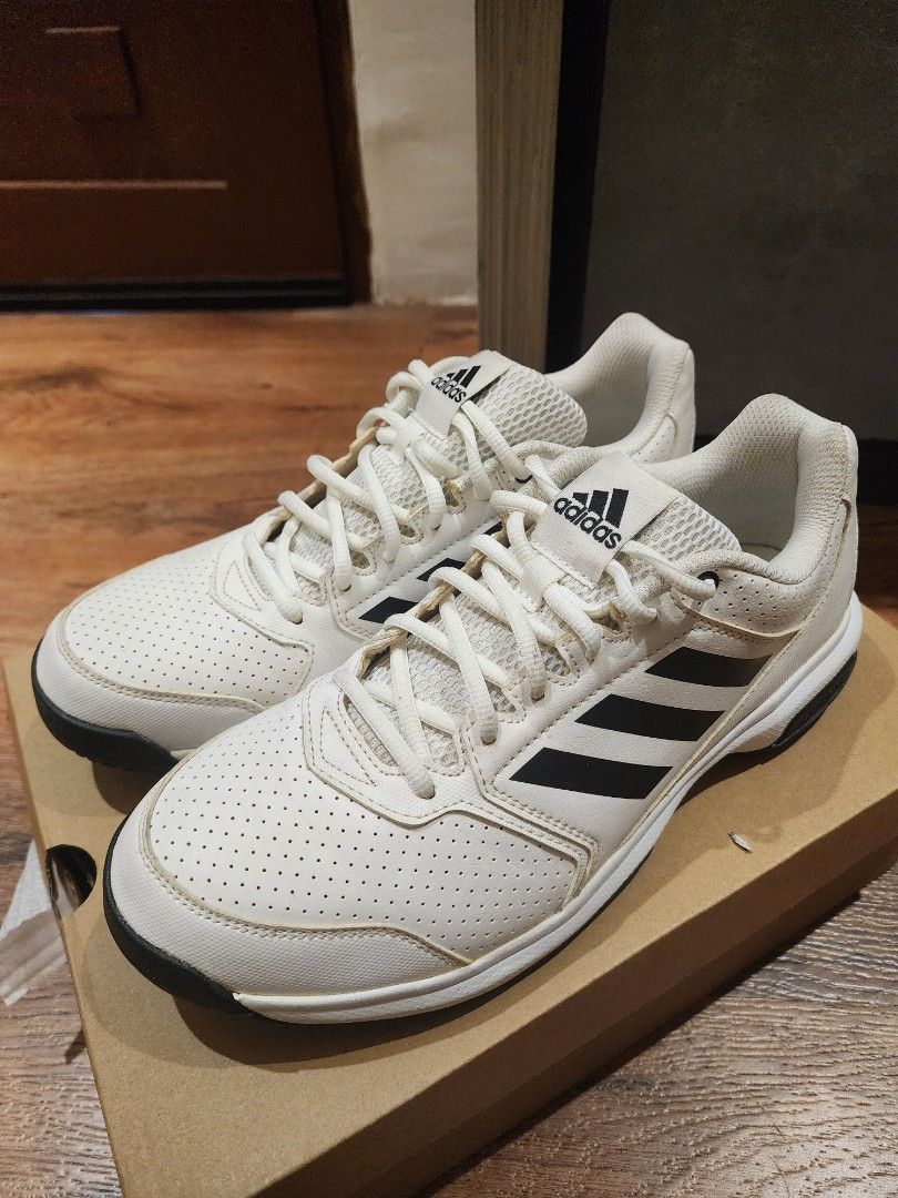 Adidas White Black Sneakers US 10.5 (Category: Sneakers) located in Manila. Submitted by kg613 (Listing ID 1466773352, Image 1). Description: - Brand: Adidas - Color: White with black stripes - Size: US 10.5 / UK 10 / FR 44 / JP 280 - Features: Perforated toe box, lace-up closure, breathable mesh tongue - Condition: Good, with minor yellowing on the laces from storage - Inclusions: Original brown shoebox included.
