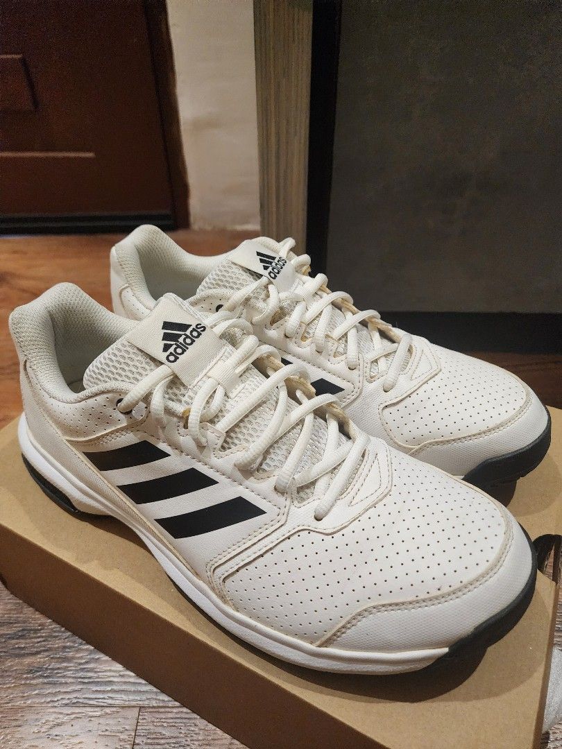 Adidas White Black Sneakers US 10.5 (Category: Sneakers) located in Manila. Submitted by kg613 (Listing ID 1466773352, Image 2). Description: - Brand: Adidas - Color: White with black stripes - Size: US 10.5 / UK 10 / FR 44 / JP 280 - Features: Perforated toe box, lace-up closure, breathable mesh tongue - Condition: Good, with minor yellowing on the laces from storage - Inclusions: Original brown shoebox included.