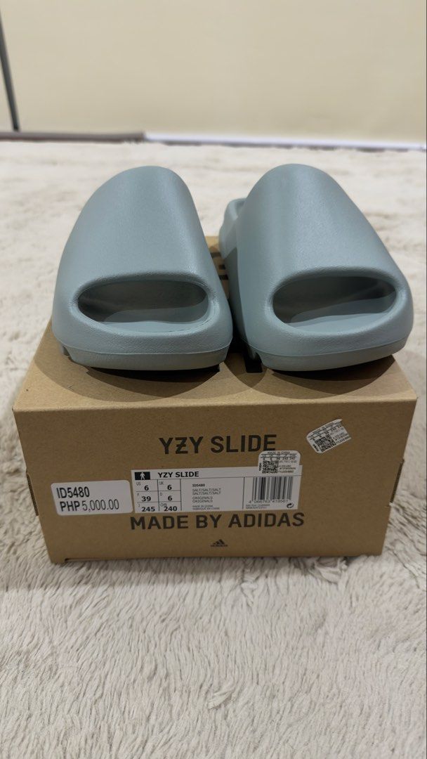 Adidas Yeezy Slides Salt (Category: Slippers & Slides) located in Cavite. Submitted by kel_manalo (Listing ID 1466587708, Image 2). Description: - Brand: Adidas 100% original - Color: salt - Style: Slip-on slides with textured footbed and embossed heel branding - Condition: Like new / Clean minimalist look - Inclusions: Comes with the original shoebox - Ideal for: Everyday casual use and maximum comfort.