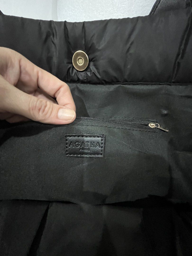 AGATHA Paris Black Puffer Tote Bag (Category: Tote Bags) located in Talisay. Submitted by cherylu (Listing ID 1466570737, Image 2). Description: Black quilted puffer tote bag from Agatha Paris. Features the signature Scottish Terrier dog silhouette appliqué on the front in black leatherette. Dual shoulder straps, magnetic snap closure, and an interior zip pocket with a branded leather tag. Spacious interior for daily essentials. Lightweight nylon