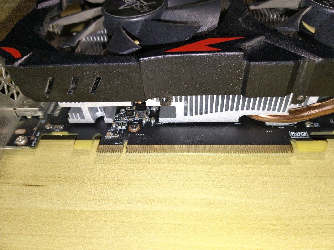 Aisurix AMD RX 580 8GB 2048SP GPU (Category: Computer Parts) located in Marikina City. Submitted by rareocean_9df934 (Listing ID 1466769411, Image 3). Description: - Brand/Model: Aisurix AMD RX 580 - Memory: 8GB VRAM with 2048 stream processors - Cooling: Dual fan setup with copper heat pipes - Design: Sleek black shroud with red accents and backplate with cooling slots - Condition: Clean unit, manufacturer stickers intact, standard PCIe interfac