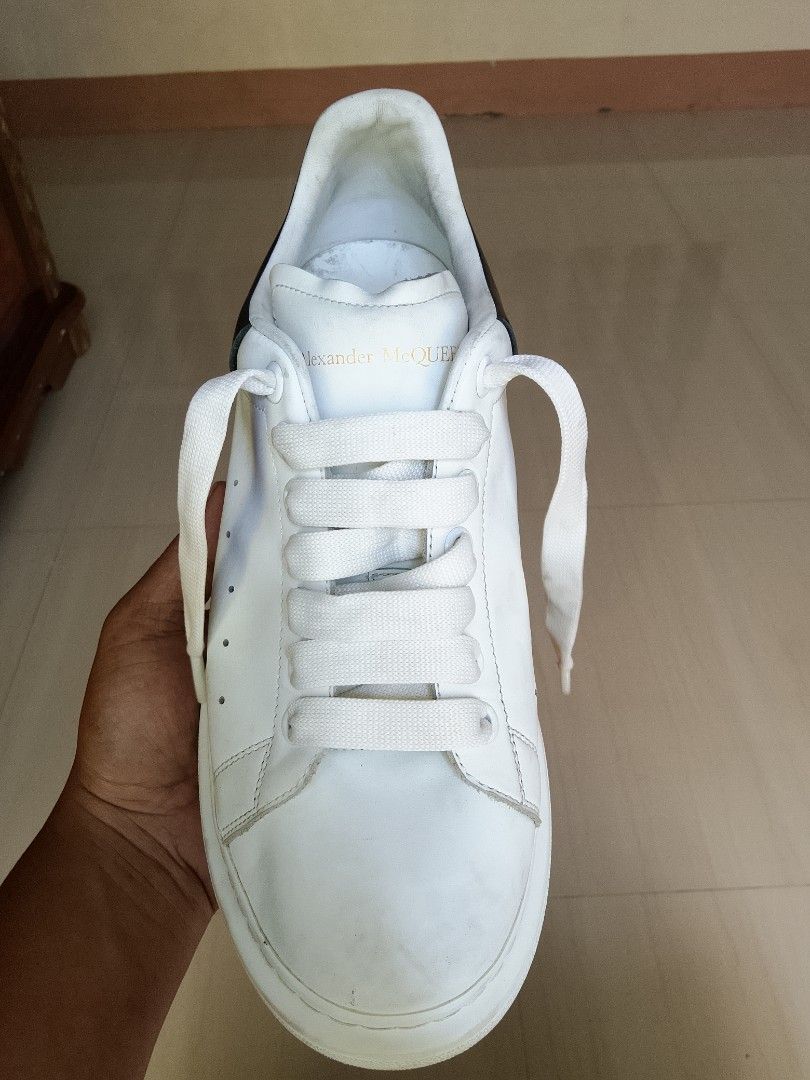 Alexander McQueen Oversized Sneaker White Black Size 41 (Category: Sneakers) located in Manila. Submitted by arjaygoodfind (Listing ID 1466657633, Image 3). Description: - Brand/Model: Alexander McQueen Oversized Sneakers - Colorway: White leather with striking black heel counters - Size: EU 41 (stamped inside the tongue) - Details: Signature gold foil logo stamped on the tongues and back tabs - Soles: Iconic thick white rubber soles - Condition: