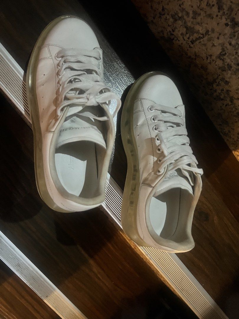 Alexander McQueen Oversized Tread Slick Sneakers White (Category: Sneakers) located in Paranaque City. Submitted by sctmpque (Listing ID 1466733437, Image 3). Description: - Brand: Alexander McQueen - Color: White with clear chunky soles - Material: Premium leather upper with side perforations - Design: Classic low-top, lace-up closure, branded heel counter and tongue - Condition: Worn with visible outsole wear and minor yellowing on the transpar