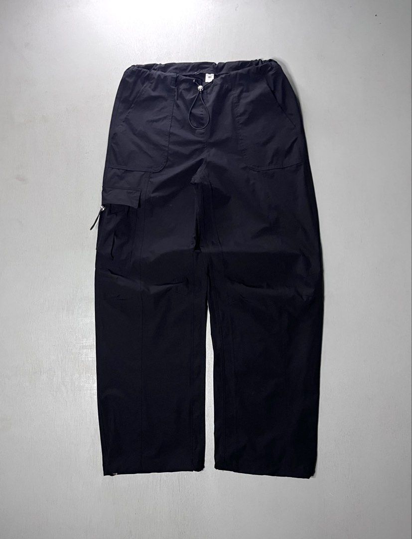 Alo Yoga Black Cargo Pants (Category: Jeans) located in Catbalogan. Submitted by yellfindss (Listing ID 1466751787, Image 1). Description: - Brand: Alo Yoga -28-34 adjustable waist / 38 lo 9 - Item: Utility Cargo Pants - Color: Black - Material: Lightweight nylon - Fit: Relaxed wide-leg - Waistband: Drawstring with toggle hardware - Pockets: Multiple, including side cargo compartments - Cuffs: Adjustable drawstrings with metal stoppers - Branding