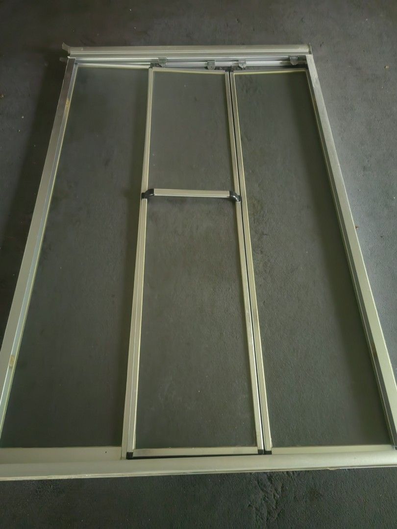 Aluminium 3-panel sliding screen door frame kit (Category: Locks, Doors & Gates) located in Makati City. Submitted by donald1983 (Listing ID 1466584886, Image 1). Description: - Complete 3-panel sliding insect screen door kit - Durable silver aluminium frame with mesh inserts - Includes outer frame, sliding tracks, and mounting tabs - Extra vertical support channels on the side for added stability - Ideal for DIY patio door installation or replac