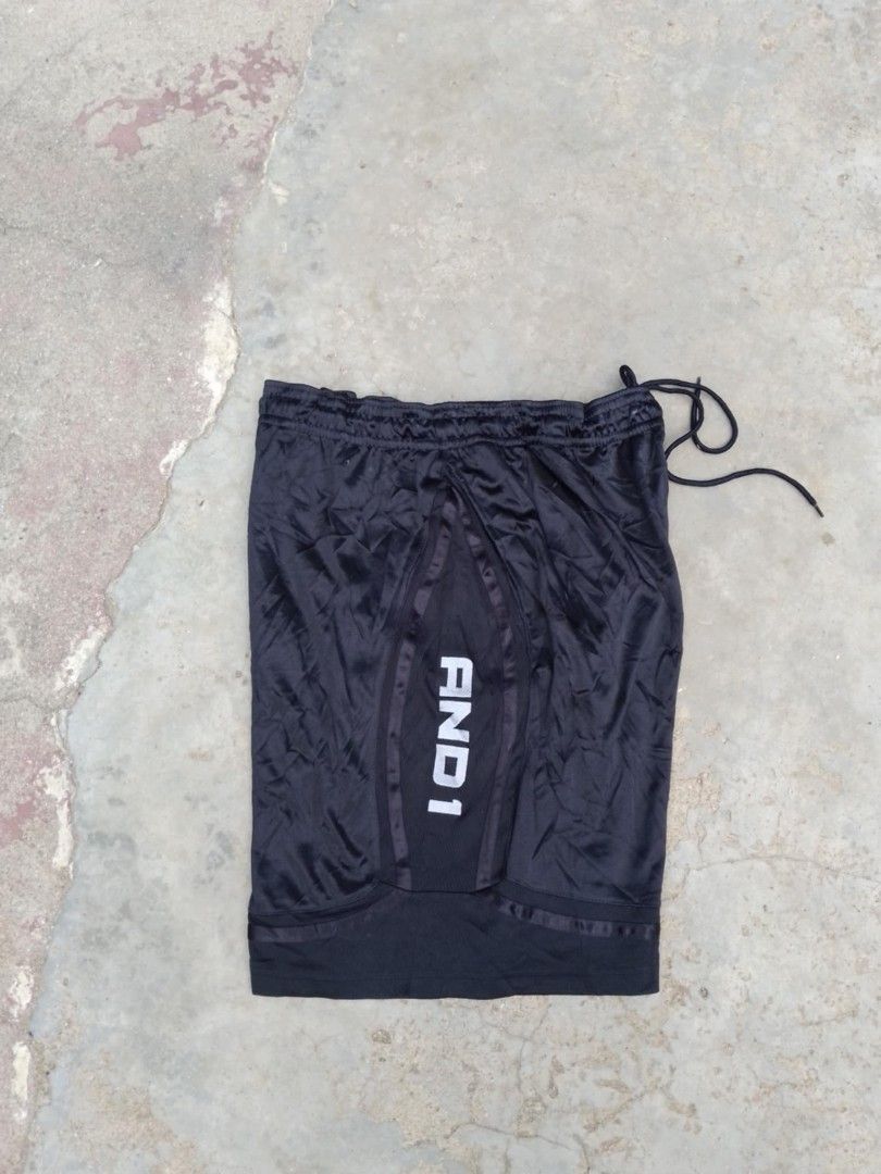 AND1 Black Basketball Shorts with Drawstring (Category: Shorts) located in Vallehermoso. Submitted by threy (Listing ID 1466674359, Image 3). Description: - Brand: AND1 - Color: Black - Fit: Elastic waistband with adjustable black drawstring - Design: Center front paneling with bold white branding - Material: Lightweight fabric - Ideal for: Workouts, basketball, or lounging - Condition: Clean, no tears or stains.