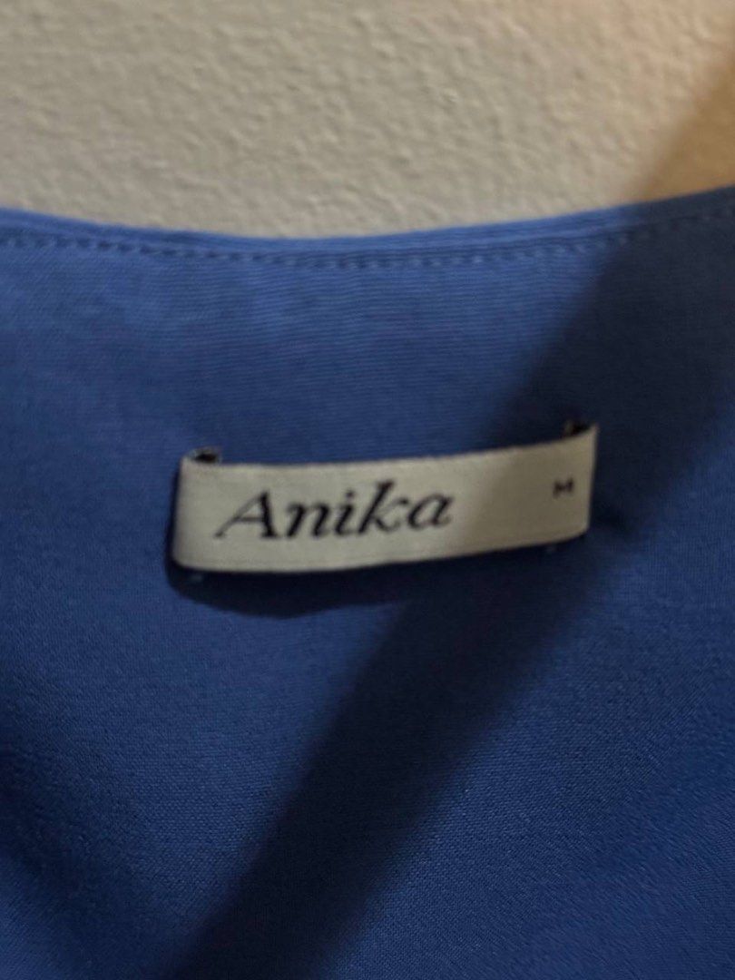 Anika Blue Cropped Tank Top Size M (Category: Sleeveless) located in Taguig. Submitted by anxmz (Listing ID 1466677057, Image 2). Description: - Brand: Anika - Size: Medium - Color: Bright blue - Design: Square neckline with thick, twisted shoulder straps - Fit: Cropped and relaxed, flowy hemline - Styling: Perfect for summer, looks great with high-waisted jeans or shorts.