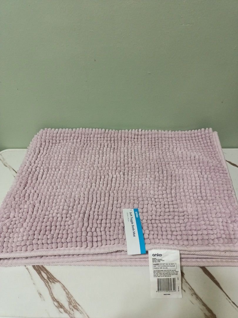 Anko Soft Toggle Bath Mat Pink (Category: Bathtub & Bath Accessories) located in Antipolo. Submitted by cathrift_ (Listing ID 1466724031, Image 2). Description: - Brand: Anko - Color: Pink - Size: 60cm x 90cm - Condition: Brand new with original store tags attached, never used - Material/Texture: Plush textured surface that is soft underfoot and absorbs water well - Care: Machine washable (follow care label instructions) - Perfect for adding a co