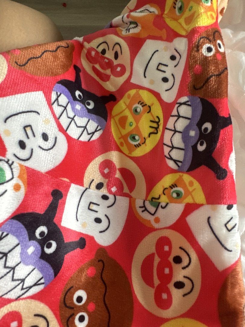 Anpanman Character Fleece Jacket Red (Category: Coats, Jackets and Outerwear) located in Cainta. Submitted by shopbyyna (Listing ID 1466595336, Image 3). Description: - Design: Bright red fleece jacket featuring popular Anpanman characters (Baikinman, Shokupanman, Currypanman) - Lining: Cozy white quilted inner lining for extra warmth - Closure: Convenient tie-front with attached fabric straps - Material: 100% polyester (soft and durable) - Size/