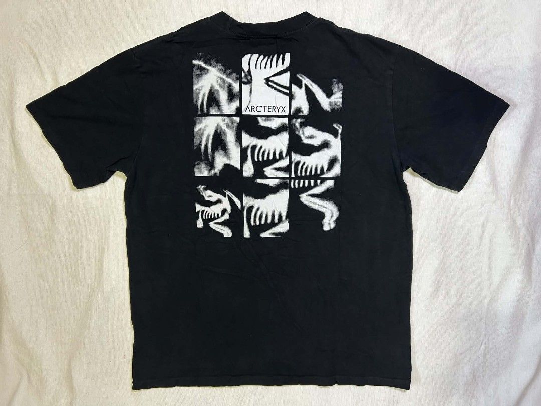 Arc'teryx Graphic Black T-Shirt (Category: Tshirts & Polo Shirts ) located in Caloocan City. Submitted by russelle35 (Listing ID 1466744831, Image 2). Description: - Brand: Arc'teryx - Color: Black - Design: Small fossil logo on chest, large skeleton grid graphic on the back - Fit: Short sleeves with ribbed crew neckline - Condition: Brand new / Excellent - Quirky detail: Inner care label has a factory error stating 'Zeta SL Pant Men's' - Perfect