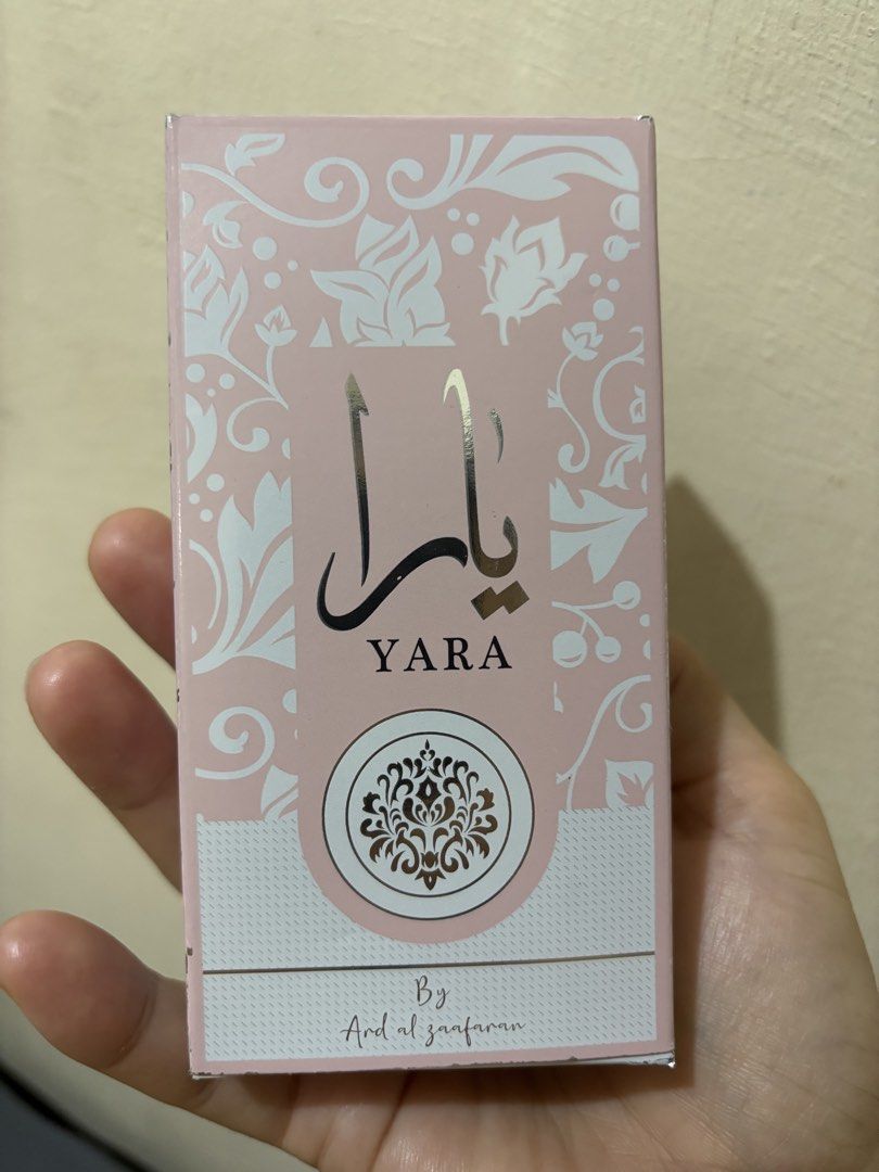 Ard Al Zaafaran Yara Perfume 50ml (Category: Fragrance & Deodorants) located in Balayan. Submitted by authenticfindsbymrb (Listing ID 1466712012, Image 1). Description: - Authentic Ard Al Zaafaran Yara Perfume (50ml) - Made in U.A.E. - Condition: Brand new, full bottle, unused - Comes in original pink floral box packaging - Features a spray nozzle with a sleek silver cap - For external use only.