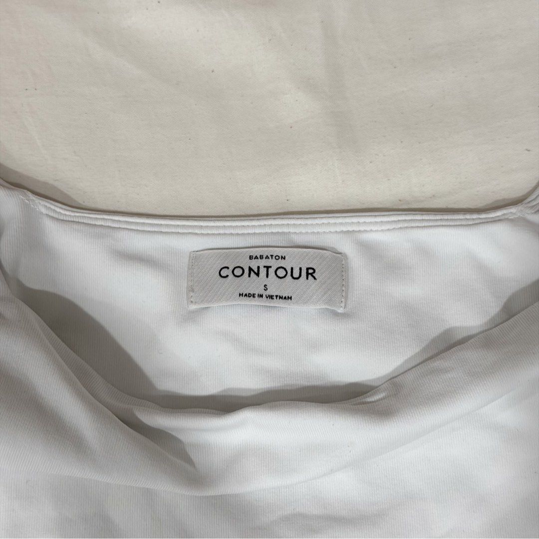 Aritzia Babaton Contour White Bodysuit (Category: Longsleeves) located in Manila. Submitted by jeanettetaneca (Listing ID 1466665945, Image 3). Description: - Size: S - RFS: I don’t really wear it anymore, would prefer if this wasn’t a body suit since I felt uncomfy down there everytime I was wearing this haha but THE QUALITY IS SO GOOD WTF. - No when worn pic sorry since last time I wore this 2024 pa and I can’t find pics anymore - Price is nego