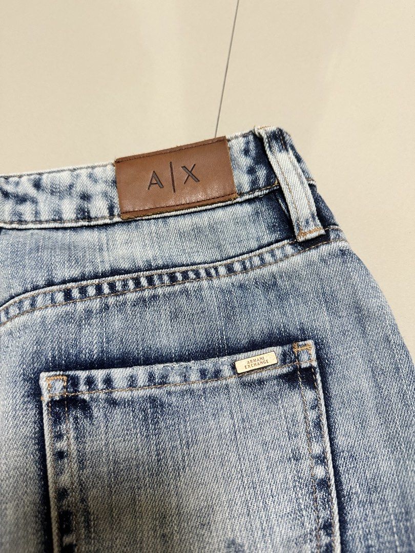 Armani Exchange (A|X) Distressed Denim Mini Skirt (Category: Skirts) located in Davao. Submitted by theresetshelf (Listing ID 1466721930, Image 3). Description: • Authentic Armani Exchange (A|X) • Beautiful light-to-medium vintage wash denim • Features vertical panel seams, subtle distressing, and a trendy frayed raw hem • Very well maintained, no stains or flaws! 📏 PM for measurements / questions. .