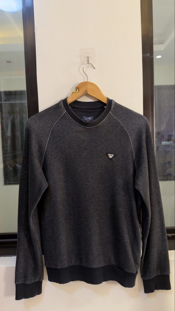 Armani Jeans Grey Washed Sweatshirt (Category: Coats, Jackets and Outerwear) located in Paranaque City. Submitted by preluxeshop_ph (Listing ID 1466769111, Image 2). Description: Armani Jeans Grey Washed Sweatshirt -Small triangular logo on chest -Large ‘81’ graphic on back -Condition: 9.8/10 -Dimes: Length: 24.5” Width: 20”.