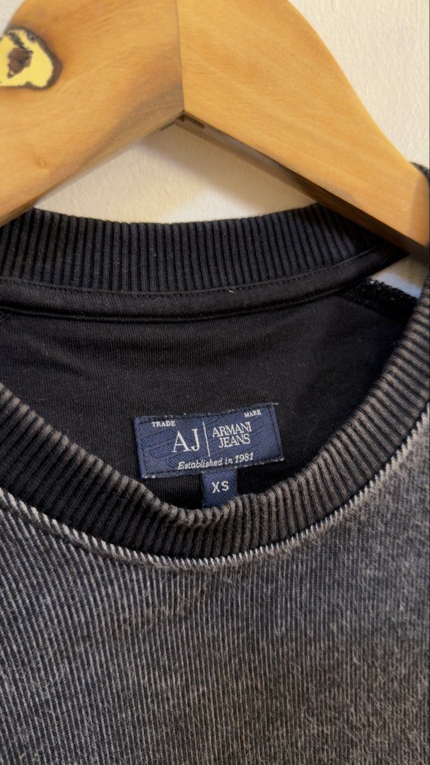 Armani Jeans Grey Washed Sweatshirt (Category: Coats, Jackets and Outerwear) located in Paranaque City. Submitted by preluxeshop_ph (Listing ID 1466769111, Image 3). Description: Armani Jeans Grey Washed Sweatshirt -Small triangular logo on chest -Large ‘81’ graphic on back -Condition: 9.8/10 -Dimes: Length: 24.5” Width: 20”.