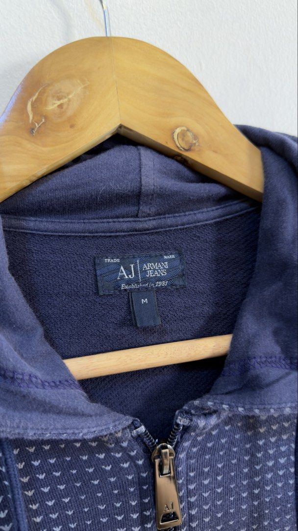 Armani Jeans Navy Blue Patterned Zip-Up Hoodie (Category: Coats, Jackets and Outerwear) located in Paranaque City. Submitted by preluxeshop_ph (Listing ID 1466769081, Image 3). Description: Armani Jeans Navy Blue Patterned Zip-Up Hoodie -Subtle all-over pattern -Zip-up front with pockets -Condition: 9.8/10 -Dimes: Length: 26” Width: 21”.